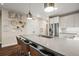 Modern kitchen featuring an island with bar seating, stainless steel fridge, and stylish decor at 20 Wilcox # 421, Castle Rock, CO 80104