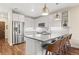 Stylish kitchen with white cabinets, stainless steel appliances, and sleek countertops at 20 Wilcox # 421, Castle Rock, CO 80104
