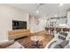 Open living area with wood floors, breakfast bar, and modern decor at 20 Wilcox # 421, Castle Rock, CO 80104