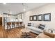 Spacious living room with open kitchen, breakfast bar, and modern furnishings at 20 Wilcox # 421, Castle Rock, CO 80104