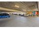 View of a parking garage with a mural that says Castle Rock and several parked cars and trucks at 20 Wilcox # 421, Castle Rock, CO 80104