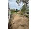 An expansive backyard with sparse ground cover and stone and concrete paver elements at 2625 W Ellsworth Ave, Denver, CO 80219