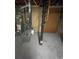 A grey water heater and heater sit on the floor in the basement at 2625 W Ellsworth Ave, Denver, CO 80219