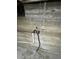Pipes and electrical work run along the unfinished concrete wall of the basement at 2625 W Ellsworth Ave, Denver, CO 80219