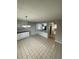 A light-filled kitchen features ample counter space, white cabinetry, and a tile floor at 2625 W Ellsworth Ave, Denver, CO 80219