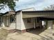 Home's rear exterior featuring a covered carport extending along the side, offering ample covered parking at 2625 W Ellsworth Ave, Denver, CO 80219
