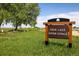 Erie Lake Open Space sign surrounded by trees and green grass at 2117 Stonehenge Cir, Lafayette, CO 80026