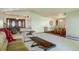 Spacious living room with an open layout, leading to the dining area and featuring a grand entryway at 2117 Stonehenge Cir, Lafayette, CO 80026