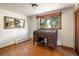 Bright office featuring a wooden roll top desk, natural light, and a picture window with views of the outdoors at 2117 Stonehenge Cir, Lafayette, CO 80026