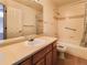 Bathroom featuring a shower and tub combo, and a granite vanity top at 6407 S Dallas Ct, Englewood, CO 80111