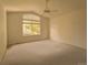 Spacious bedroom features ample natural light and a ceiling fan at 6407 S Dallas Ct, Englewood, CO 80111