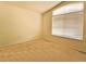 Bright bedroom with large window and plush carpeting, perfect for relaxation at 6407 S Dallas Ct, Englewood, CO 80111
