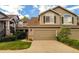Inviting two-story home with a well-maintained lawn and a spacious two-car garage at 6407 S Dallas Ct, Englewood, CO 80111