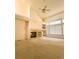 Inviting living room features a fireplace, built-in shelving, and abundant natural light at 6407 S Dallas Ct, Englewood, CO 80111