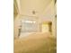 Bright living room boasts high ceilings, a cozy fireplace, and expansive windows at 6407 S Dallas Ct, Englewood, CO 80111