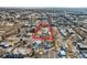 Aerial view of the home within a red boundary, highlighting its location in the neighborhood at 5300 Balsam St, Arvada, CO 80002