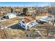 Aerial view of charming house with a porch surrounded by mature trees at 5300 Balsam St, Arvada, CO 80002