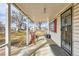 Cozy covered front porch with classic architectural details, perfect for relaxing at 5300 Balsam St, Arvada, CO 80002