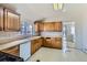 Bright kitchen features a window over the sink and wooden cabinets at 5300 Balsam St, Arvada, CO 80002