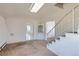 Living room with stairs and view to the kitchen at 5300 Balsam St, Arvada, CO 80002