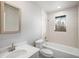Bright bathroom featuring a tub and shower combo, large vanity, and toilet at 1801 Buttercup Rd, Elizabeth, CO 80107