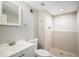 Tiled bathroom features a shower with glass door, vanity, and neutral color palette at 1801 Buttercup Rd, Elizabeth, CO 80107