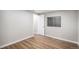 Bedroom featuring hard surface floors, fresh paint, and a window at 1801 Buttercup Rd, Elizabeth, CO 80107