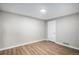 Bedroom featuring hard surface floors, fresh paint, and a door at 1801 Buttercup Rd, Elizabeth, CO 80107