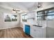 Quaint kitchen with view of backyard, stainless steel appliances and modern vinyl flooring at 1801 Buttercup Rd, Elizabeth, CO 80107