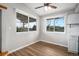 Cozy kitchen features dual windows with view of the backyard and sleek vinyl flooring at 1801 Buttercup Rd, Elizabeth, CO 80107