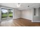 Living room has wood-look floors, sliding glass doors, and an abundance of natural light at 1801 Buttercup Rd, Elizabeth, CO 80107