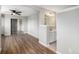 Large main bedroom with hard surface floors and connected bathroom vanity with large mirror at 1801 Buttercup Rd, Elizabeth, CO 80107