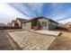 A spacious backyard with a concrete patio area, and a wood fence at 6284 N Genoa Way, Aurora, CO 80019