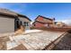 A patio area with backyard including wooden fence at 6284 N Genoa Way, Aurora, CO 80019