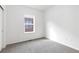 Neutral bedroom featuring carpet and a window providing natural light at 6284 N Genoa Way, Aurora, CO 80019