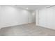 Bedroom featuring carpet, two large closets with sliding doors, and a window at 6284 N Genoa Way, Aurora, CO 80019