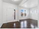 Bright and airy living room featuring hardwood floors and lots of natural light at 6284 N Genoa Way, Aurora, CO 80019