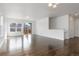 Spacious living area featuring hardwood floors, recessed lighting, and bright natural light at 6284 N Genoa Way, Aurora, CO 80019