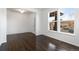 Bright open-concept living room showcasing hardwood floors and natural light at 6284 N Genoa Way, Aurora, CO 80019