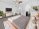 Staged main bedroom with neutral walls, carpet and a contemporary design at 6284 N Genoa Way, Aurora, CO 80019