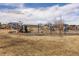 A fun community playground with swings and play equipment for to enjoy at 6284 N Genoa Way, Aurora, CO 80019