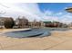 Community pool covered during off-season with neighborhood houses surrounding the area at 6284 N Genoa Way, Aurora, CO 80019