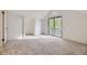 Bright bedroom with neutral carpet, large window, vaulted ceiling, and closet at 1304 Ceres Dr, Lafayette, CO 80026