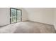 Bright bedroom features neutral carpet, a large window, and lots of natural light at 1304 Ceres Dr, Lafayette, CO 80026