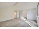 Bright bedroom features neutral carpet and multiple closets for storage at 1304 Ceres Dr, Lafayette, CO 80026