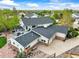 Home aerial featuring a deck and large garage at 2161 Elmwood St, Berthoud, CO 80513