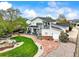 Aerial view of the back of the house showing the landscaped backyard with a hot tub and patio area at 2161 Elmwood St, Berthoud, CO 80513