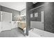 Well-appointed bathroom showcasing a tiled shower, stylish vanity, and modern fixtures at 2161 Elmwood St, Berthoud, CO 80513