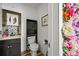 Charming bathroom with wood-look flooring and decorative accents at 2161 Elmwood St, Berthoud, CO 80513