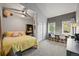 Bright bedroom with a vaulted ceiling, cozy study nook, and large windows for a relaxing and productive space at 2161 Elmwood St, Berthoud, CO 80513